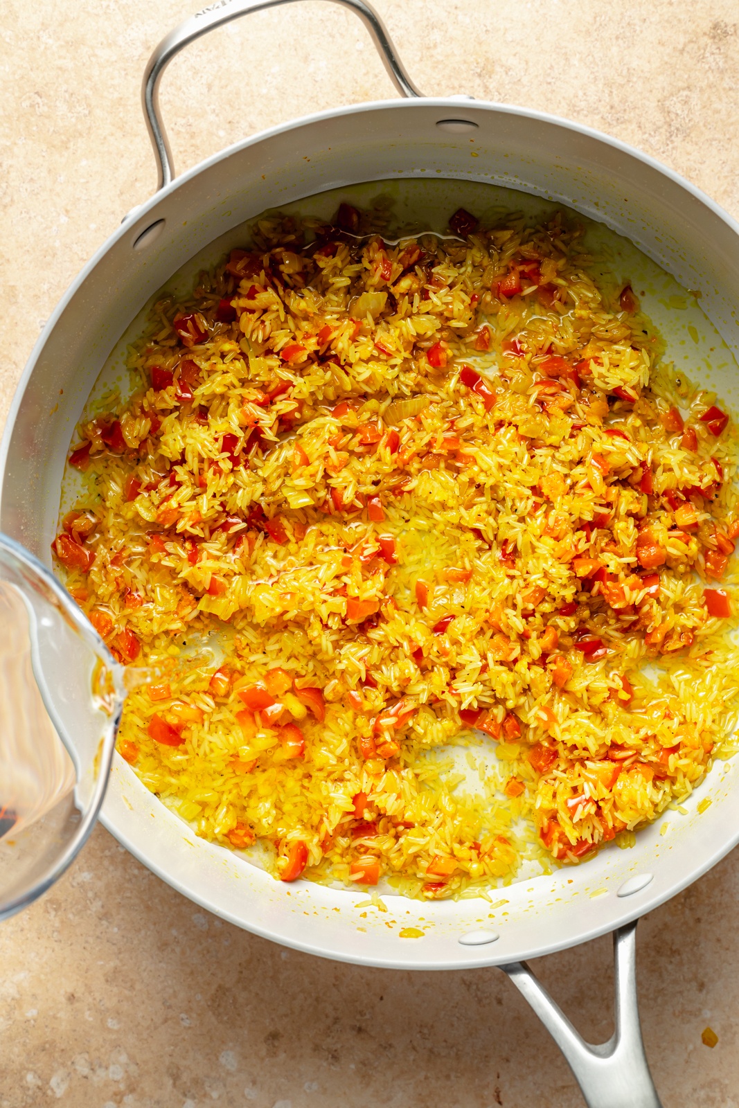 cooking vegetables to make garlic turmeric rice