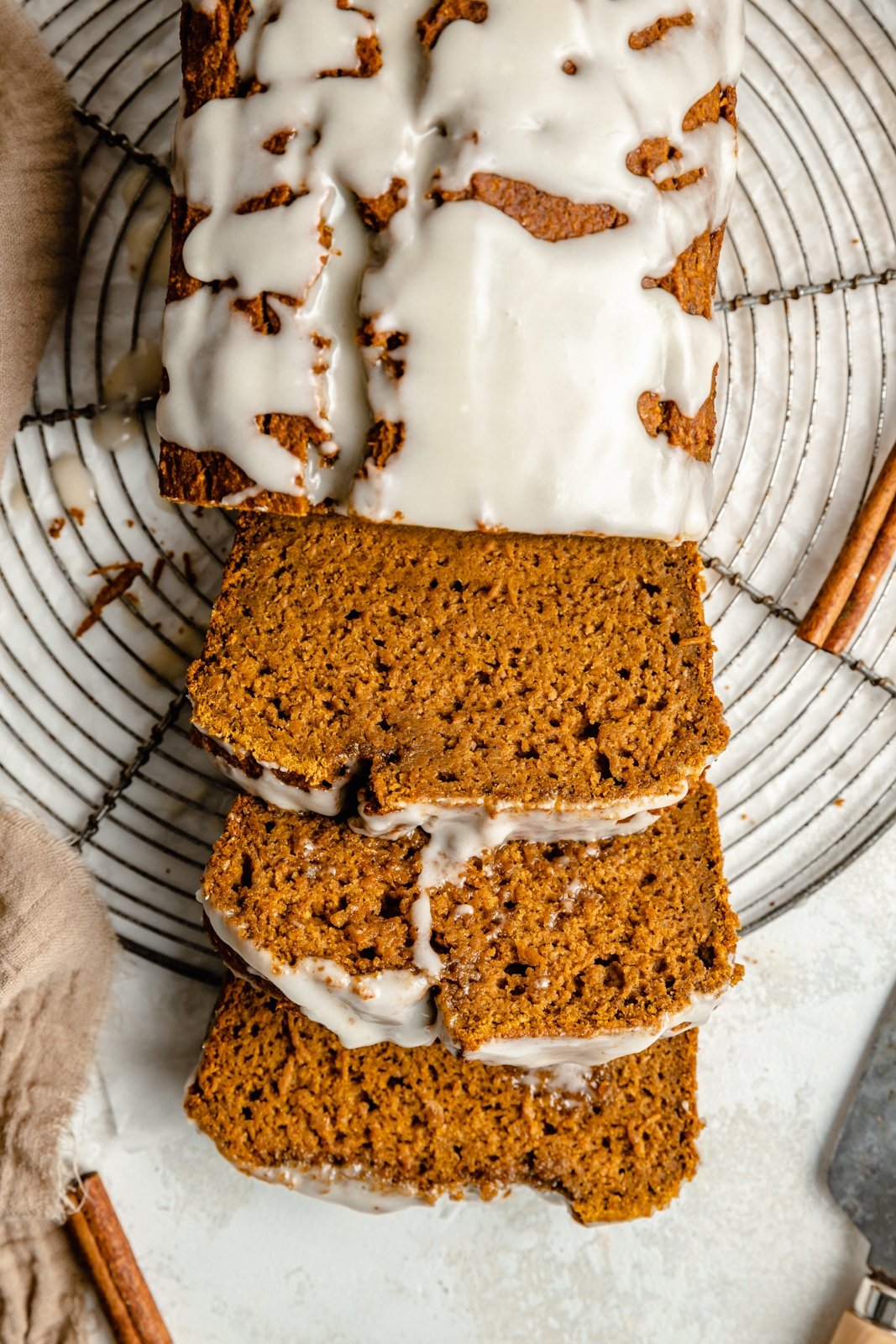 healthy pumpkin bread sliced on a wire rack