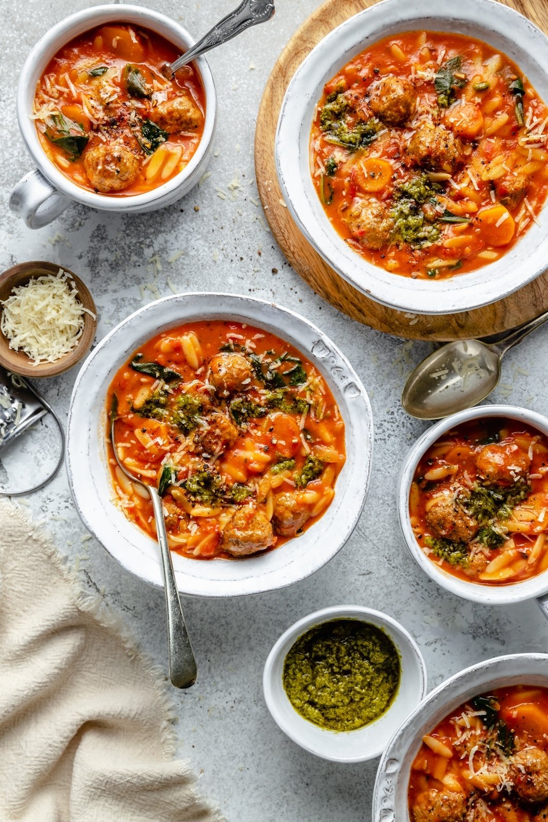creamy tomato orzo soup with mini meatballs in bowls